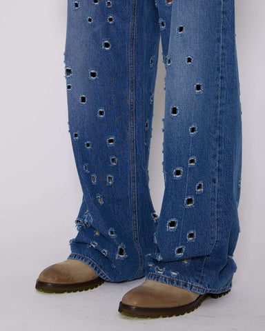 Wide leg jeans with metal holes on the front
